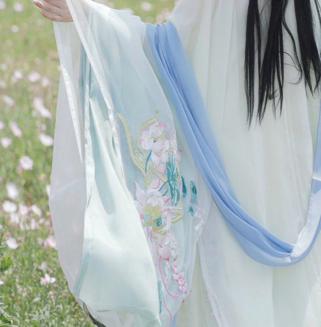 オリジナルの唐代漢服アンサンブル 4 点: 絶妙な和子スカートとワイド スリーブ シャツ - 春と夏向けの伝統的な漢の要素を使用して複雑に作られています。