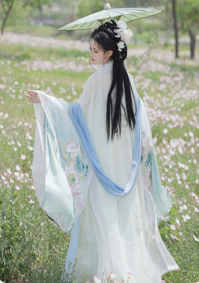 オリジナルの唐代漢服アンサンブル 4 点: 絶妙な和子スカートとワイド スリーブ シャツ - 春と夏向けの伝統的な漢の要素を使用して複雑に作られています。