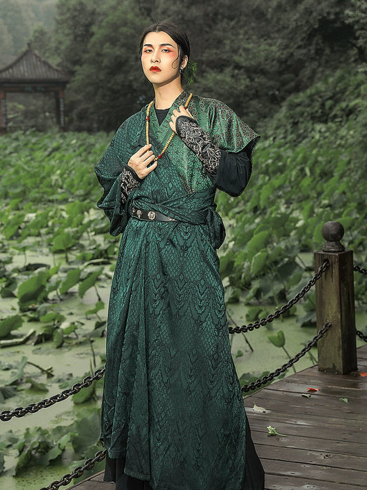 Elevate your style with our Tang Dynasty-inspired Round Collar Robe Hanfu. Crafted with attention to detail, this modern interpretation features a stylish round collar and half-arm design, perfect for men and women alike. Explore the timeless charm of ancient Chinese fashion with our green Hanfu ensemble.