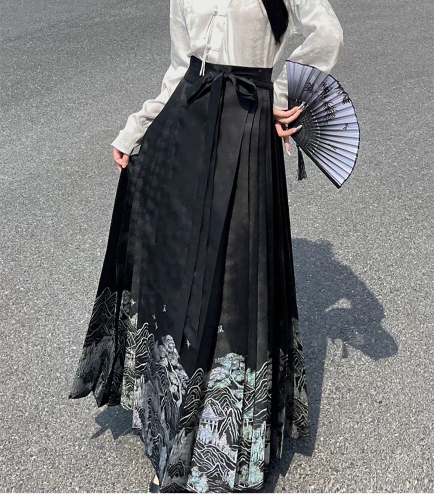 Explore modern elegance with our Black & White Shirt Women's Horse Face Skirt Suit. This ensemble blends traditional Hanfu design with contemporary flair, featuring intricate embroidery and authentic details. Embrace the timeless beauty of Hanfu fashion and make a statement with your unique style.