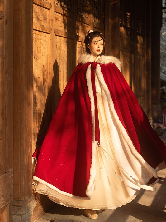 Red Hanfu Cape Featuring a diverse collection of Hanfu styles, this display presents a blend of traditional and modern elements, from the intricate embroidery of classic Hanfu to contemporary menswear. The assortment includes authentic Tang Dynasty dresses and detailed Ming Dynasty Hanfu, alongside luxurious royal attire and scholar officials' outfits. With a special emphasis on men's Hanfu, the exhibit highlights the rich cultural tapestry of traditional Asian clothing and modern, Asian-inspired fashion